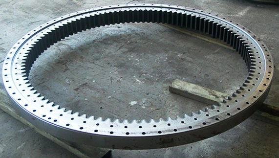 Large-diameter slew bearing gear ring laid out on the workshop floor